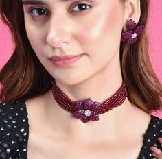 The magnificently handcrafted Victorian Ruby Star shaped Choker necklace set is based on Antque Victorian plating that celebrates the rich heritage of Indian jewelry. The Indian necklace set is a masterpiece inspired by the woman of today who loves to celebrate beauty with heritage. The bold and bright design of the necklace is perfect for all the beautiful brides to be! Pair this replica of a Sabyasachi jewelry necklace set with your ethnic or contemporary ensembles and create a look to remember. Necklace Closure - Adjustable Dori Earrings Closure - Push Back Style Tip - Versatility and elegance being the strong suit, we leave a lot to your imagination for how you want to dress your jewels your way and embrace your personal style. This pretty is made for a modern-day woman who has her hea Multicolor Flower Shape Jewelry For Party, Multicolor Party Jewelry With Flower Shape, Multicolor Flower Shape Party Jewelry, Traditional Festive Jewelry With Flower Shape, Designer Multicolor Jewelry For Party, Designer Red Jewelry For Party, Festive Flower-shaped Jewelry With Matching Earrings, Sabyasachi Jewelry, Red Choker