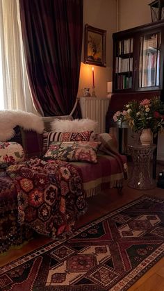 a living room filled with furniture next to a window