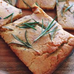 slices of bread with rosemary sprigs on top