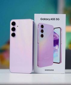 two new samsung phones are on display in the box, one is purple and the other is white