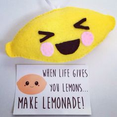 a stuffed animal with a sign that says when life gives you lemons make lemonade