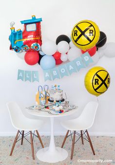 a train themed birthday party with balloons and decorations