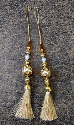 Hand made Women Hand Made Tassels Lehanga Latkan Hand  Work New Fancy Designer Tassel Fabric Silk   2 PC   Libas Fashion latkan  Beautiful Pair of Latkans & Brooch Accessory For You Decorative Products. In Indian These Latkans Are Normally Used as The Accessory For Lengha & Sari Blouse On The Back, But These Can Be Used in Many Other Ways to Metal & Pearl scan be used at an door. Rajasthan is a State in India for these kind of Art works Ethnic, Casual and Party Wear Designs Lahenga party latkan Cheap Gold Chandbalis With Latkans, Cheap Gold Necklace With Latkans, Latkan Tassels, Lengha Sari, Designer Tassels, Tassel Purse, Sari Blouse, Indian Sari, Fabric Silk