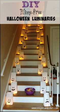 the stairs are decorated with paper bags and lit candles for halloween decorations, as well as marshmallows that look like faces