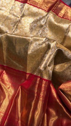 an orange and gold sari with red border