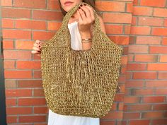 Crochet Raffia Tote Bag | Straw Beach Bag | Oversize Shoulder Bag | Boho Woven Bag | Knitting Shopping Bag | Xlarge  Bag Crochet Gold Metallic Raffia Tote Bag | Mesh Beach Woven Shoulder Bag | XLARGE Bag This handmade crocheted beach bag is completely hand-knitted using gold metallic raffia It's huge and enough for your daily needs. It is completely useful at every opportunity, from shopping to parties, from sports events to fancy parties. And of course a good accessory can do a miracle with you Chic Gold Handwoven Bag, Gold Crochet Travel Bag, Gold Handwoven Tote Bag, Chic Gold Crochet Bag For Daily Use, Gold Woven Shoulder Bag For Vacation, Chic Gold Handwoven Crochet Bag, Casual Gold Woven Bag, Gold Woven Crochet Shoulder Bag, Casual Gold Shoulder Bag For Beach