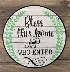 a wooden sign that says, bless this home and all who enter