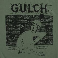 a green t - shirt with the words gulch on it and an image of a person in front of a brick wall