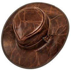 This exquisite Unforgiven Mens Outback Hat is sure to add a touch of sophistication and elegance to any outfit. Crafted from crunch leather and adorned with a timeless teardrop flat brim, this hat features a leather band with a side closing and an ornate nail ornament. The interior is lined with the highest quality champagne and copper material for a luxurious feel. Adjustable Brown Leather Snapback Hat, Classic Adjustable Distressed Brown Hat, Brown Rustic Leather Hat, Adjustable Southwestern Brown Hat, Adjustable Leather-backed Hats For Outdoor, Nail Ornament, Luis Guzman, American Hat Makers, Outback Hat