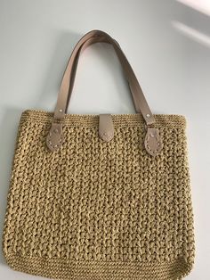 This unique and stylish handmade bag is meticulously crafted from quality paper yarn. Each one is expertly hand-knitted and finished with stylish leather handles, making the bag both durable and stylish. Since it is completely handmade, each bag may have slight differences, which means each one is unique. Product Features: 🌿 Material: High-quality paper yarn and durable leather handles 📏 Size: Large interior volume, ideal for daily use and beach needs 🎨 Color Options: Different color and size Crochet Tote Bag With Woven Leather, Everyday Double Handle Crochet Bag With Woven Leather, Double Handle Woven Leather Crochet Bag For Everyday Use, Everyday Crochet Bag With Woven Leather And Double Handle, Crochet Leather Bag With Double Handle For Everyday Use, Beige Woven Leather Crochet Bag For Everyday Use, Beige Woven Leather Crochet Bag, Straw Crochet Bag With Woven Leather And Double Handle, Crochet Straw Bag With Woven Leather And Double Handle