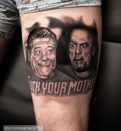 a man's leg with an image of two men and the words touch your mother on it