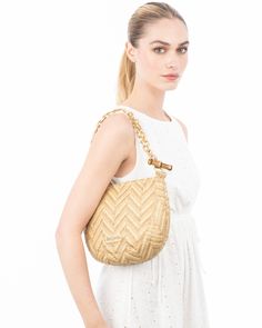 Chain Pouch Raffia is a women’s compact pouch for sale online that is perfect to use for resort through summer. Anyone racing around in a T shirt and leggings, who still wants to appear “dressed" would love this style.The bold chevron weave is a man-made raffia straw, incorporating partially recycled plastic, which was custom designed by Eric. It is soft to the touch, lightweight, not scratchy and has greater durability than natural fiber straw. The satin finish gold hardware adds polish and so Chic Summer Straw Pouch Bag, Chic Spring Pouch Straw Bag, Summer Pouch Shoulder Bag With Bamboo Handle, Natural Straw Bag For Summer On-the-go, Vacation Straw Bag With Gold-tone Hardware And Leather, Summer On-the-go Pouch Shoulder Bag, Summer Straw Bag For On-the-go, Vacation Straw Bag With Gold-tone Hardware, Summer Woven Shoulder Bag For On-the-go