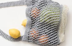 a crocheted bag with two lemons on the front and one in the back