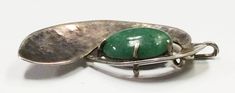 "Up for your consideration is a stunning Sterling Silver hammered Pendant with large .75\" X .5\" inch green turquoise stone. Approx length 2\" inches. Approx weight 11.96 grams." Modern Green Jewelry With Large Stone, Modern Jade Cabochon Jewelry, Modern Green Collectible Jewelry, Green Oval Modernist Jewelry, Green Modernist Oval Jewelry, Mid-century Green Collectible Jewelry, Contemporary Green Sterling Silver Jewelry, Modernist Green Jewelry For Gifts, Modern Green Chrysoprase Jewelry