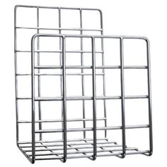 two metal racks are stacked on top of each other, one is empty and the other has