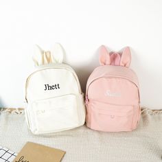 ✦ Production Time: 8-10 business days ✦ Shipping Time: USPS Ground/3-5 business days, USPS Priority/1-3 business days Hop into a world of cuteness and practicality with our adorable Bunny Backpack! This Custom Backpack is perfect for kids and toddlers, combining charm and functionality to make school days and outings extra special. ✦ Perfectly Sized: 9.5''-4.5''-12'' It's spacious enough to hold books, toys, snacks, and everything they need for their adventures. ✦ Vivid Colors: White, Black, Pin Portable Bags As Back To School Gift, Portable Bag As Back To School Gift, Portable Bag As A Back To School Gift, Softback Bags For Students End Of School Year, Student Softback Bags For End Of School Year, Cute Student Backpack With Letter Print, Cute School Bag With Letter Print, Portable Softback School Bags, Student Bags With Letter Print For Back To School