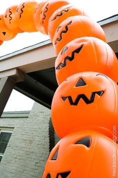 an orange halloween decoration with pumpkins on it