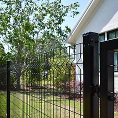 a black iron fence in front of a house