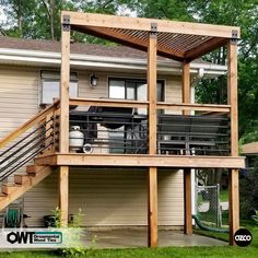 a house that has some stairs in front of it and an attached deck on the side