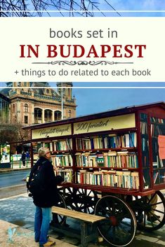 a person standing next to a book cart with books on it and the words in budapest