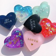 four heart shaped candys with the words my dear written on them in different colors