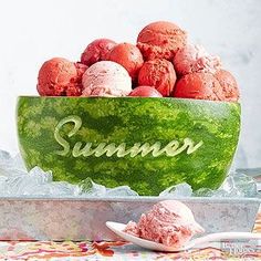 a watermelon bowl filled with scoops of ice cream