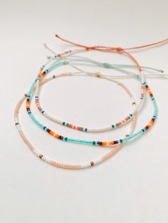 These beachy boho anklets are so dainty and would make a nice gift. They are great for everyday wear! Stack these together, with other anklets, or wear them by themselves! Choose which anklet you like best from the 8 options I have here! This listing is for a single anklet. ∙ ∙ ∙ ∙ ∙ ∙ ∙ ∙ ∙ ∙ ∙ ∙ Festival Strand Beaded Bracelets With Tiny Beads, Festival Tiny Bead Strand Bracelets, Bohemian Beaded Strand Bracelets For Friendship, Festival Tiny Beads Strand Bracelet, Adjustable Dainty Anklets With Colorful Beads, Adjustable Beaded Beachy Anklets, Bohemian Anklets With Sliding Knot For Beach, Adjustable Strand Anklets For Festival, Festival Tiny Beads Strand Bracelets