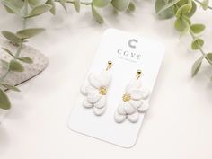 COVE Clay Designs  🌱 Flourish Collection - No.12 Handcrafted white flower clay earrings with 24k gold plated findings. Dainty and elegant floral earrings with handcrafted petal details, perfect for your beach and summer outfits or for a beautiful bride. The Flourish Collection is a beautiful floral/botanical collection representing the beauty of personal growth. When we are committed to -and invest time - in becoming the best version of ourselves, we blossom and grow into something really speci White Bridal Earrings With Flower Shape As Gift, White Earrings With 3d Flowers For Anniversary, White Adjustable Jewelry With 3d Flowers, Handmade White Floral Bridal Earrings For Gift, Anniversary White Flower Charm Earrings, White Flower Decorated Earrings For Anniversary, White Flower Earrings For Anniversary, White Flower Bridal Earrings Gift, White Flower Bridal Earrings For Anniversary