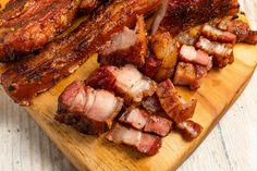 sliced bacon on a wooden cutting board