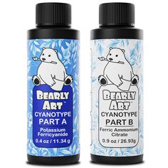 two bottles of beary art paint sitting next to each other on a white background