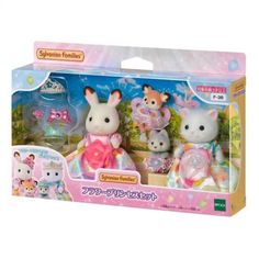 two toy animals are in the box with other toys behind them, including one bunny and another cat