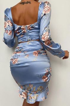 Add some elegance to your wardrobe with this sexy yet chic two-piece dress, crafted from high-quality shiny satin, and printed with an adorable floral design with a blue theme. This co-ord set is featuring a nice square neck crop top with long bishop sleeves with a cuffed end and has a back zipper closure, paired with a sexy high-waisted bodycon skirt with ruffle hems and elastic waistline. Details: Women Set Blue Floral Print Satin Dress High Waist Two Piece Ruffle Squareneck Puffed Bishop Long Print Satin Dress, Printed Satin Dress, Crop Top Skirt Set, Stylish Work Attire, Top Skirt Set, Crop Top Skirt, Blue Floral Print, Neck Crop Top, Trend Fashion