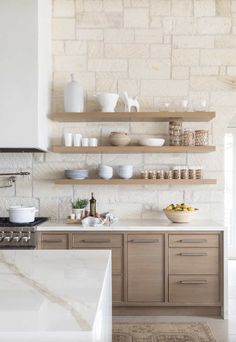 the kitchen is clean and ready for us to use it's shelves are made of wood