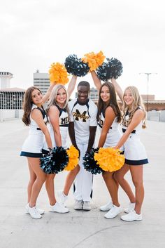 a group of cheerleaders posing for a photo