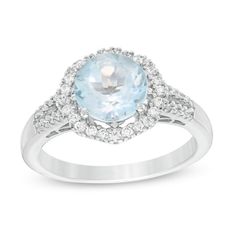 Provide a regal essence with this splendid gemstone ring. Fashioned in sterling silver, this intriguing look features an 8.0mm sky-blue topaz centered in an octagon-shaped halo of shimmering lab-created white sapphires. Additional created sapphires line the shank. Polished to a bright shine, this design pairs well with her evening attire. This ring is custom-made to fit your ring size. Sterling silver rings cannot be resized after purchase. Elegant Light Blue Brilliant Cut Ring, Light Blue Diamond Ring With Center Stone, Fine Jewelry Light Blue Diamond Ring With Center Stone, Light Blue Halo Setting Fine Jewelry, Light Blue Brilliant Cut Fine Jewelry Ring, Light Blue Diamond Ring Fine Jewelry, Fine Jewelry Aquamarine Diamond Ring With Center Stone, Formal Light Blue Rings With Accent Stones, Light Blue Jewelry With Diamond Accents