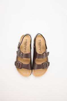 Experience unbeatable comfort and style with the Maibulun double strap slingback footbed sandal. The classic design provides maximum support and stability, making it the perfect choice for all-day wear. The stylish brown adds a touch of classic to any outfit. Upgrade your footwear game with these must-have sandals. 0.59" inch heel Slip-on / buckle closure with secure slingback strap Hard Cushioned footbed Man-made leather upper Man-made lining EVA sole Comfortable Adjustable Slingback Sandals With Buckle, Adjustable Slingback Sandals With Round Toe, Classic Everyday Sandals With Cushioned Footbed, Comfortable Brown Footbed Sandals With Adjustable Strap, Adjustable Slingback Sandals With Textured Footbed, Comfortable Slingback Sandals For Everyday, Double Strap Sport Sandals With Cushioned Footbed, Comfortable Leather Slingback Footbed Sandals, Casual Brown Slingback Footbed Sandals