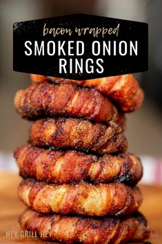 bacon wrapped smoked onion rings stacked on top of each other