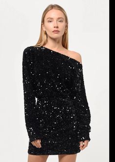 Elevate your style with our stunning Sequin Boatneck Mini Dress in black! The dazzling black sequins add a touch of glamour, while the off the shoulder design and 3/4 sleeves make it a chic and versatile choice for any party. Get ready to turn heads in this must-have mini dress! Mini Dress Sequin, Dress Sequin, Black Strappy Heels, Luxury Women Fashion, Tweed Dress, Sequin Mini, Sequin Mini Dress, Low Iron, Shoulder Design