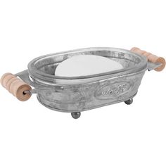 a metal bowl with two wooden handles and a white substance in the center on wheels