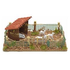 a toy farm with animals and a fence