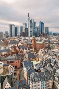 an aerial view of the city with tall buildings