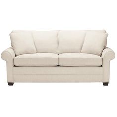 a white couch with two pillows on it