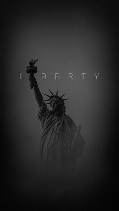 the statue of liberty in black and white with text liberty on it's side