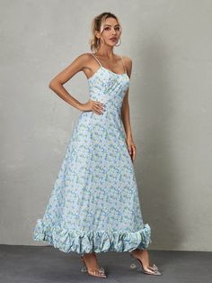 The Ilsa Spaghetti Floral Maxi Dress in Blue is a breathtaking display of beauty and charm. With its delicate spaghetti straps and vibrant floral pattern, it exudes a sense of feminine grace and elegance. The flowing maxi length adds an ethereal touch, making it an ideal choice for special occasions or summer soirées where effortless glamour is desired. Material: 100% Polyester Invisible zipper opening at the back Stretch Factor: Non Stretch Clean: Gentle machine wash Color may vary due to the l Blue Sundress With Adjustable Straps For Garden Party, Blue Fitted Maxi Dress With Ruffled Straps, Light Blue Spring Dress With Adjustable Straps, Blue Sundress With Adjustable Straps For Spring, Blue Maxi Dress With Ruffled Straps For Vacation, Light Blue Maxi Sundress For Spring, Light Blue Spaghetti Strap Maxi Dress For Beach, Blue Sundress With Spaghetti Straps For Garden Party, Blue Maxi Dress With Ruffled Straps For Garden Party