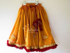 This ethnic lehenga featuring cape sleeve and jerry worked choli and tutu edged skirt accompanied with a sequienced dupatta. Please Visit My Shop For More Unique Collection https://www.etsy.com/shop/Chitralie BUYER'S PLEASE LEAVE YOUR CONTACT NUMBER. It's necessary for shipping. Fabric and Work Choli: Cape sleeve with jerry and sequence embroidered tissue fabric. The choli is lined in soft cotton fabric and ties at the back. The hanging is made with unique fabric flowers. Skirt: Gathered shimmer Traditional Ruffled Sharara For Navratri, Traditional Anarkali Set With Ruffles For Navratri, Festive Anarkali Set With Ruffles For Diwali, Festive Ruffled Anarkali Set For Diwali, Traditional Yellow Ruffled Sharara, Ruffled Traditional Wear For Navratri, Festive Traditional Wear With Ruffles For Navratri, Navratri Festive Traditional Wear With Ruffles, Traditional Wear With Ruffles And Traditional Drape For Festivals