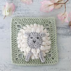 a crocheted square with a sheep on it