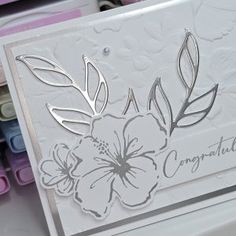 a close up of a card with flowers on it