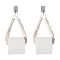 two rolls of toilet paper hanging from rope