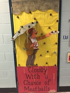 a door decorated to look like a man holding an umbrella with the words cloudy witch and chance of meatballs written on it