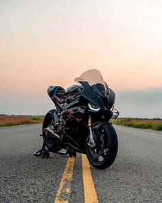 the motorcycle is parked on the side of the road